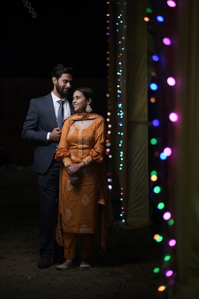 Anju and Sant, under the fairy lights